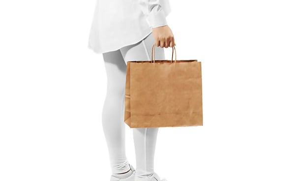 Free Mockup of Woman Carrying Paper Bag